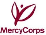 A red logo of mercy corps with the word " mercycorp ".