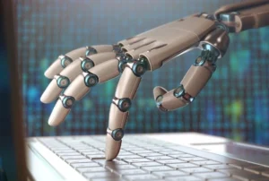 A robot hand is shown on top of a keyboard.